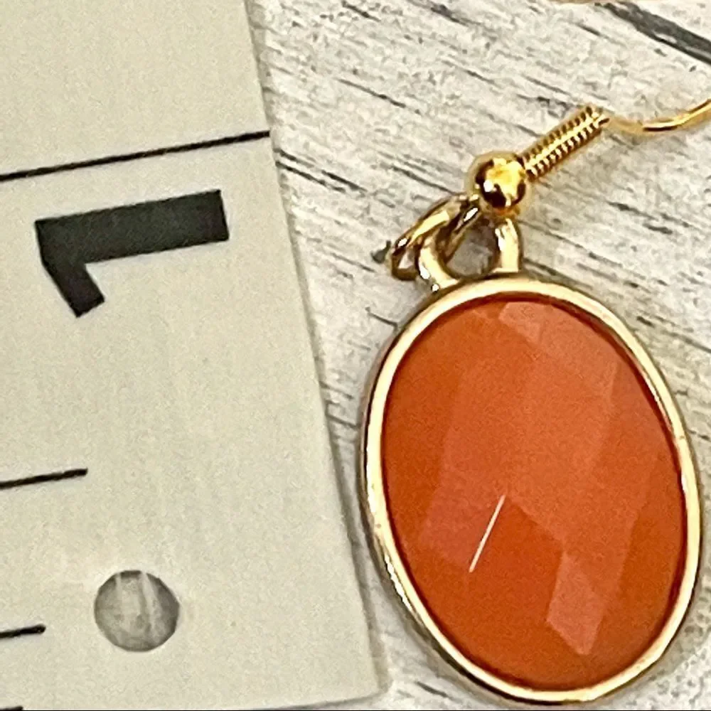 Gold tone orange drop earrings gold tone